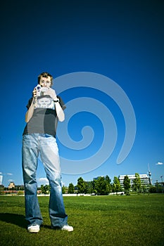 Young man with video camera