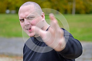 Young man with a vindictive expression