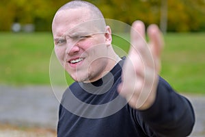 Young man with a vindictive expression