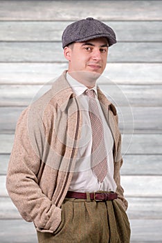 Young man in vintage clothes with hat, 1940 style