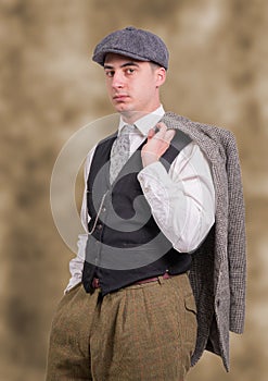 Young man in vintage clothes with hat, 1940 style