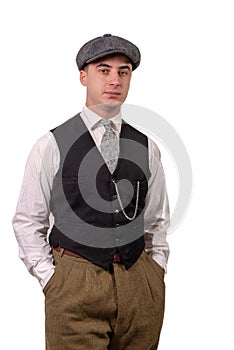 Young man in vintage clothes with hat, 1940 style, on white