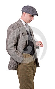 Young man in vintage clothes, looking watch, 1940