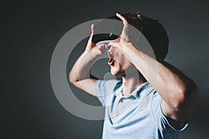 Young man with a virtual reality headset