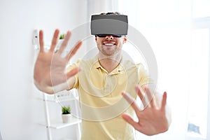 Young man in virtual reality headset or 3d glasses