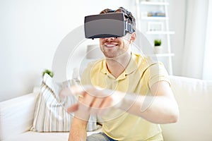 Young man in virtual reality headset or 3d glasses