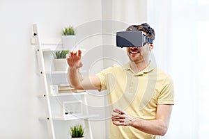 Young man in virtual reality headset or 3d glasses