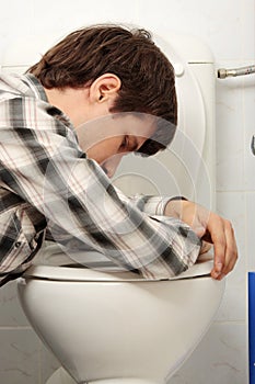 Young man vomiting photo