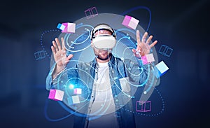 Young man in vr glasses hands touching blocks in metaverse