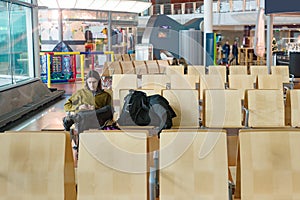 Young man waiting alone at the airport