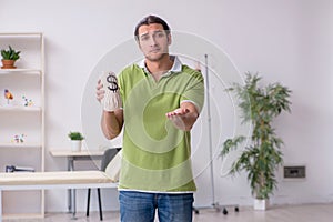 Young man waiting for doctor in the clinic