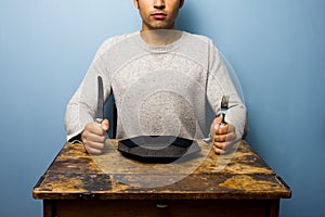 Young man waiting for his dinner