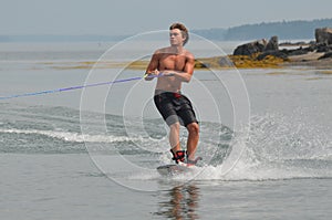 Young Man Wakeboarding in Maine