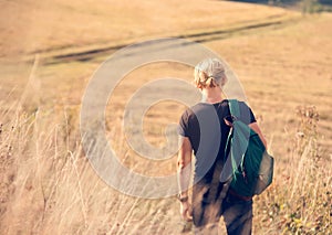 Young man walk on country side