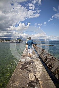 Young man walking in the dock