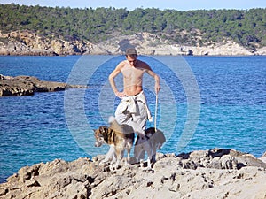 young man walking his dogs