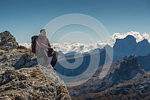 Young man watching the beauty of nature in south tyrol, rifugio lagazuio, passo falzarego, italien dolomites