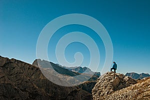 Young man watching the beauty of nature in south tyrol, rifugio lagazuio, passo falzarego, italien dolomites