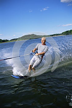 A young man water skiing
