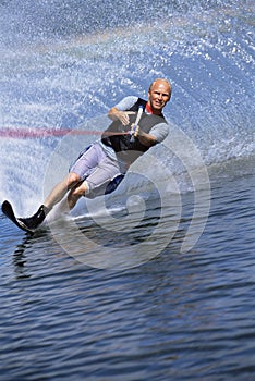 A young man water skiing