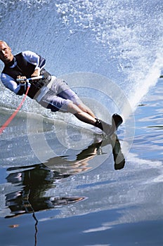 A young man water skiing