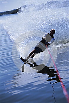 A young man water skiing