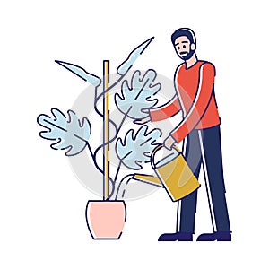 Young Man Watering and Planting Flower. Gardener or Florist Working in Botanical Garden or Home Backyard Terrace