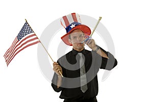Young man wearing 4th of July hat and holding flag