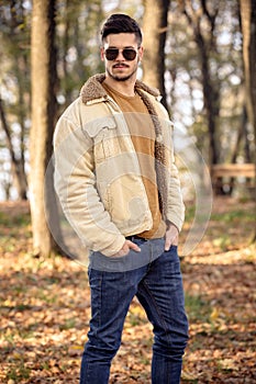 Young man wearing autumn fashionable clothing