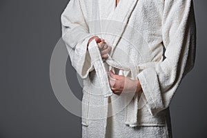 Young man wearing bathrobe after spa treatment