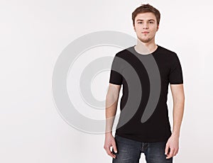 Young man wearing blank t-shirt isolated on white background. Copy space. Place for advertisement. Front view