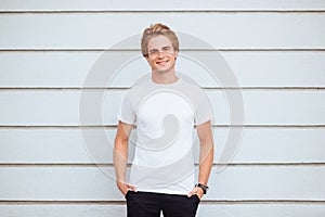 Young man wearing blank tshirt and blue jeans