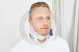 Young man wearing cervical collar