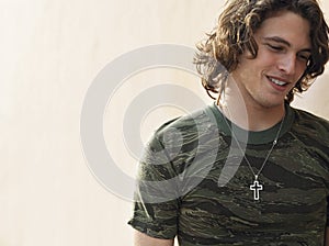 Young Man Wearing Cross Shape Necklace