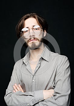 Young man wearing eyeglasses over black background. Lifestyle concept.Close up.