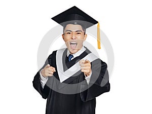 Young man wearing graduation cap and ceremony robe hand pointing to camera