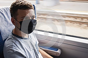 Young man wearing protective face mask sitting in the traing