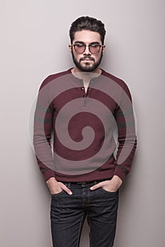Young man wearing sunglasses and a burgundy sweater