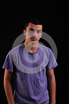 Young man wearing t-shirt looking at camera