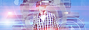 Composite image of young man wearing virtual reality glasses