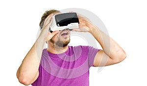 Young man wearing virtual reality googles / VR Glasses