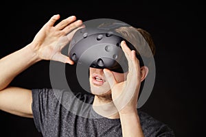 Young Man Wearing Virtual Reality Headset In Studio