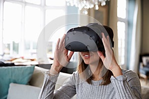 Young Man Wearing Virtual Reality Headset In Studio