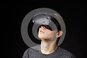 Young Man Wearing Virtual Reality Headset In Studio