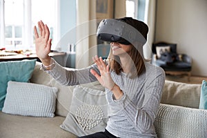 Young Man Wearing Virtual Reality Headset In Studio