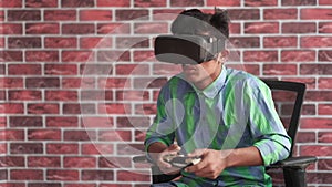 young man wearing virtual reality headset, vr box and playing games