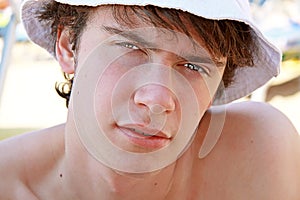 The young man and a white cap