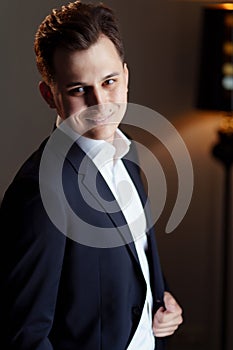 young man in white shirt and a black jacket. business portrait. Wedding. fiance