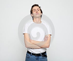 Young man, white shirt, casual style, close up over white background.