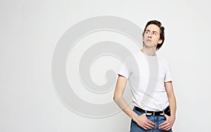 Young man, white shirt, casual style, close up over white background.